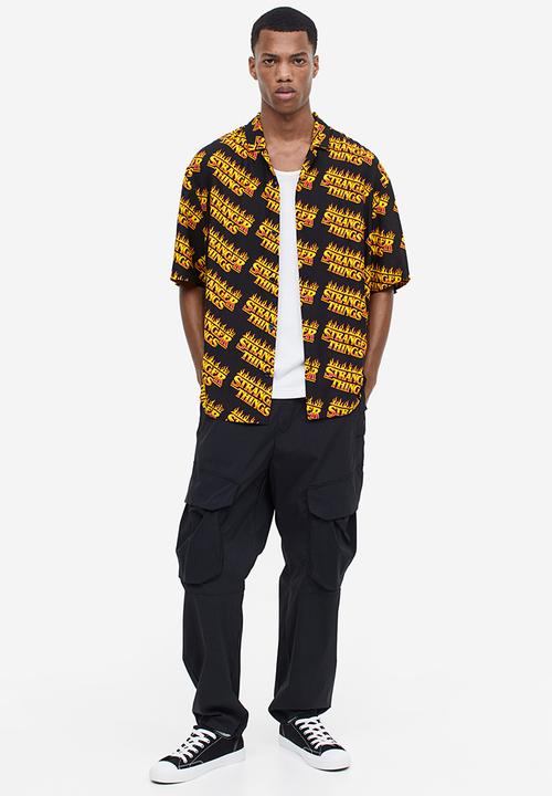 H&M - Relaxed fit patterned resort shirt - black/stranger things