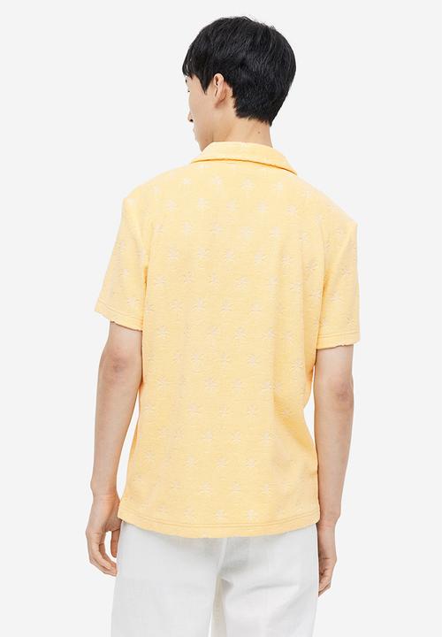 H&M - Regular fit terry polo shirt - yellow/palm trees
