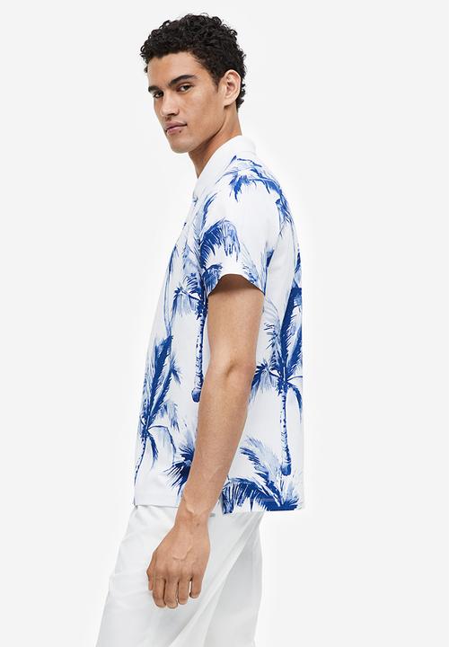 H&M - Regular fit printed polo shirt - white palm trees