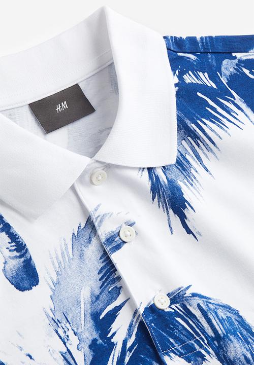 H&M - Regular fit printed polo shirt - white palm trees