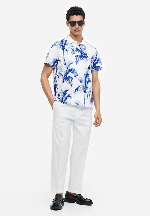 H&M - Regular fit printed polo shirt - white palm trees