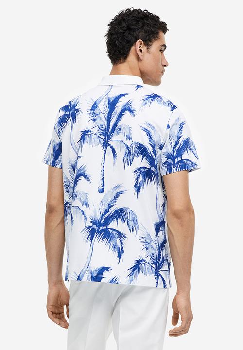 H&M - Regular fit printed polo shirt - white palm trees