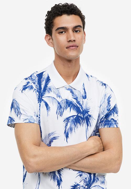 H&M - Regular fit printed polo shirt - white palm trees