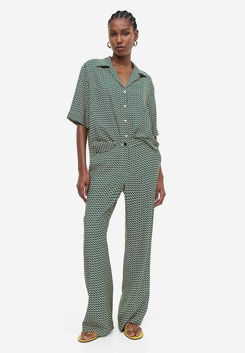 H&M - Flared trousers - dark green & patterned