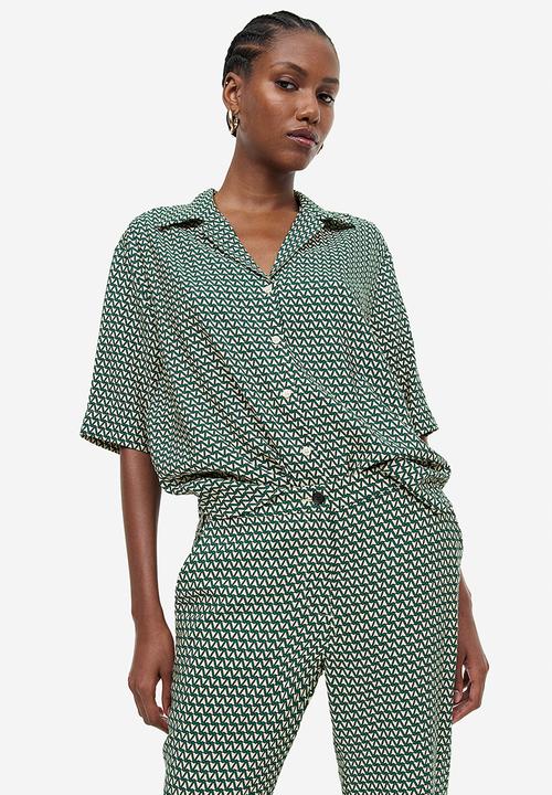 H&M - Flared trousers - dark green & patterned