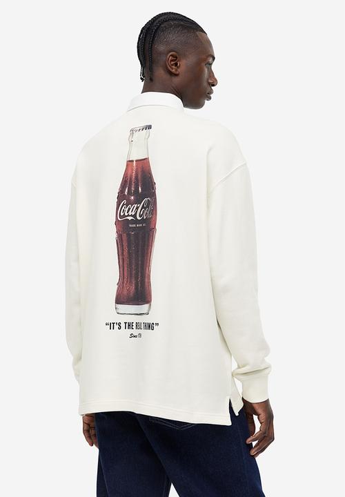H&M - Relaxed fit printed polo shirt - Cream Coca-Cola