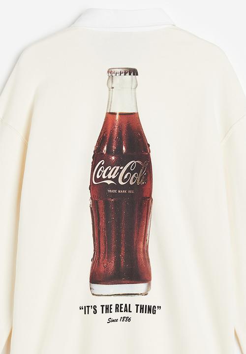 H&M - Relaxed fit printed polo shirt - Cream Coca-Cola