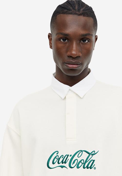 H&M - Relaxed fit printed polo shirt - Cream Coca-Cola