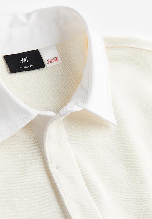 H&M - Relaxed fit printed polo shirt - Cream Coca-Cola