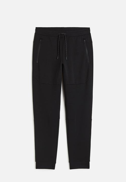 H&M - Drymove™ tapered tech joggers with zipped pockets - black