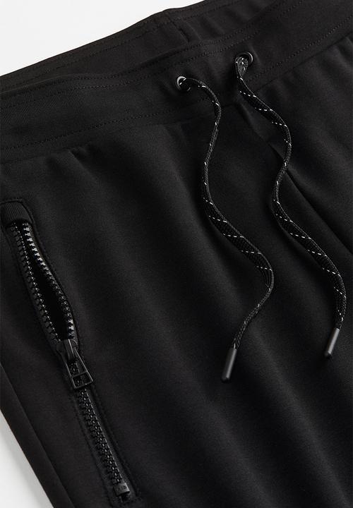 H&M - Drymove™ tapered tech joggers with zipped pockets - black