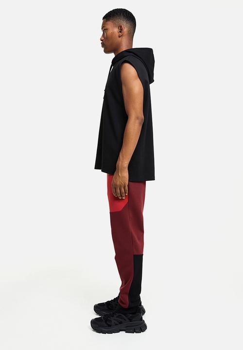 H&M - Drymove™ tapered tech joggers with zipped pockets - red