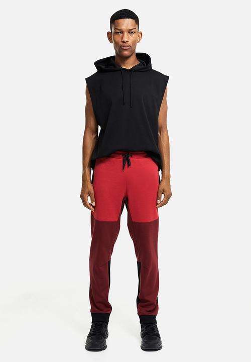 H&M - Drymove™ tapered tech joggers with zipped pockets - red