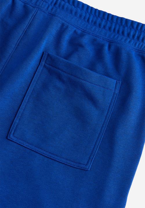 H&M - Coolmax® loose fit sweatshorts - Bright blue Peace symbol