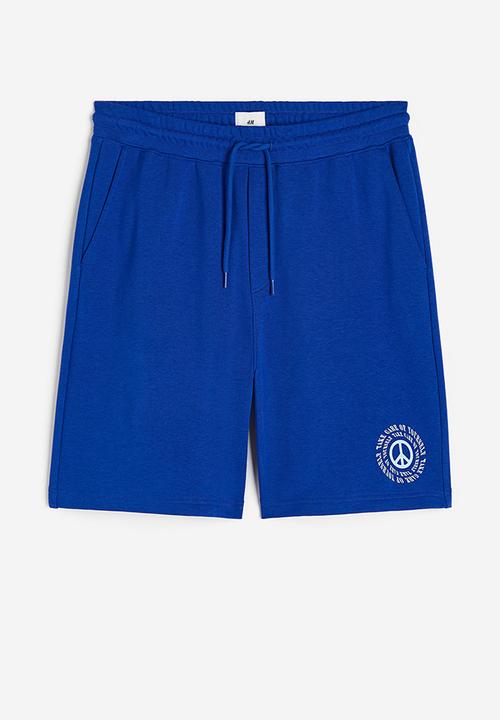 H&M - Coolmax® loose fit sweatshorts - Bright blue Peace symbol