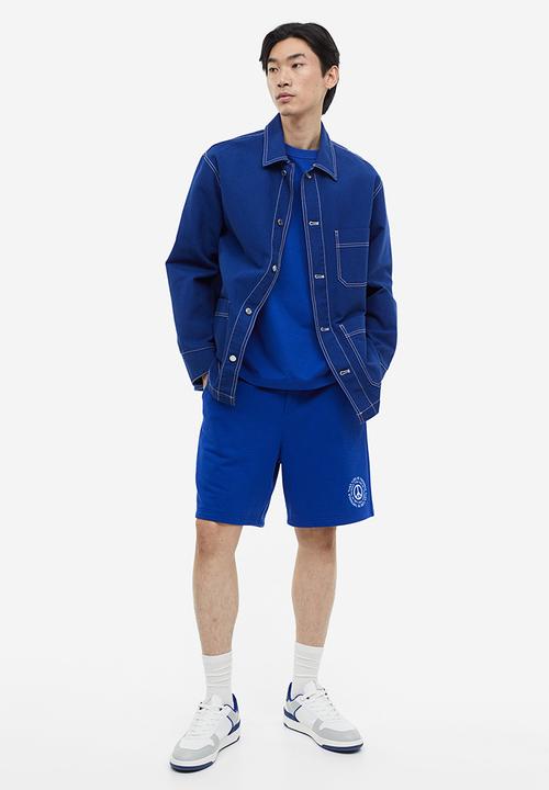 H&M - Coolmax® loose fit sweatshorts - Bright blue Peace symbol