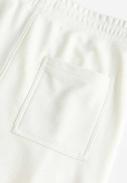 H&M - Coolmax® loose fit sweatshorts - white