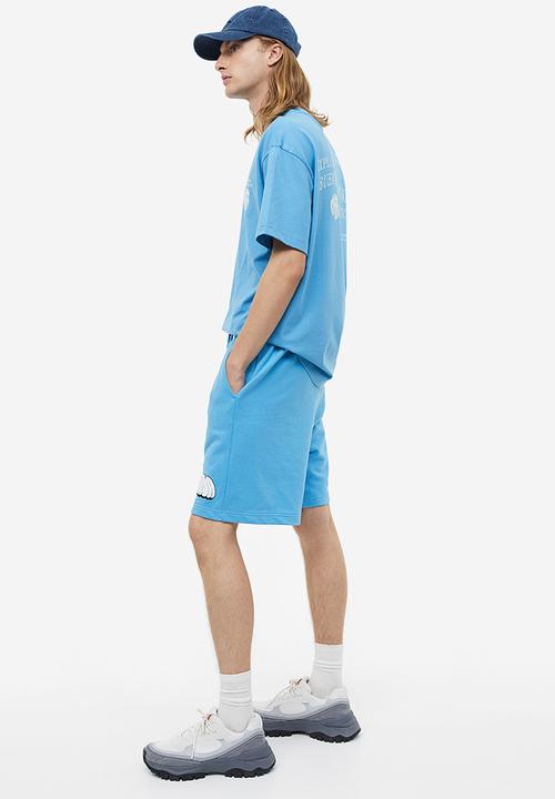 H&M - Relaxed fit printed sweatshorts - light blue/strada