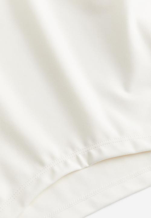 H&M - Drymove™ cropped sports top - cream