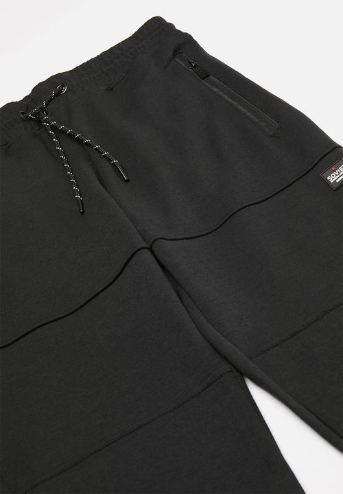 SOVIET - Track pants - black