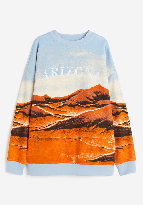 H&M - Oversized printed sweatshirt - light blue/arizona