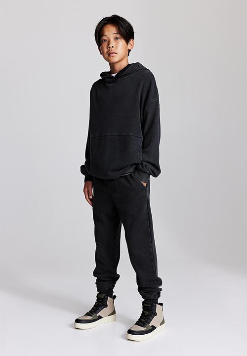 H&M - Printed joggers - black/washed out