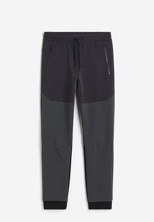 H&M - Drymove™ tapered tech joggers with zipped pockets - black