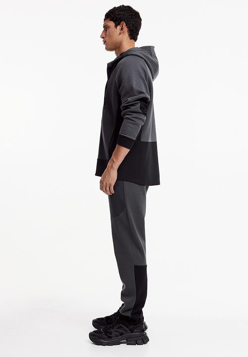 H&M - Drymove™ tapered tech joggers with zipped pockets - black