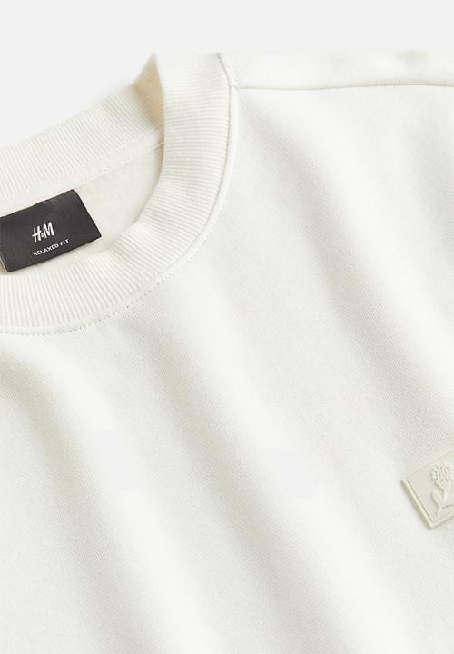 H&M - Relaxed fit appliquéd sweatshirt - cream 