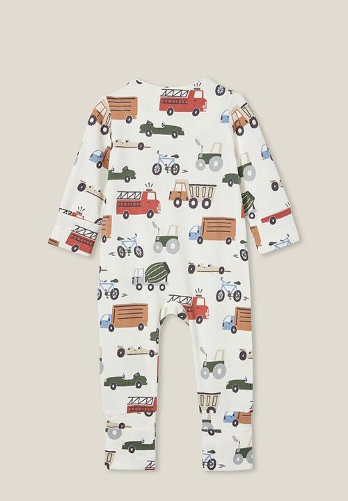 Cotton On - The long sleeve zip romper - vanilla/vintage construction trucks