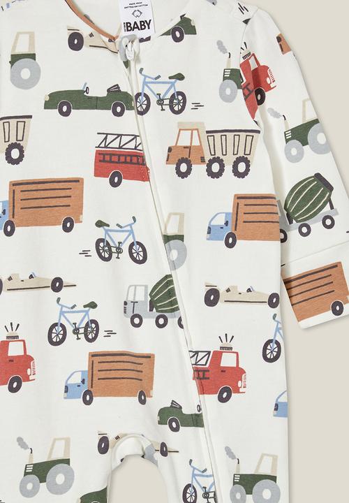 Cotton On - The long sleeve zip romper - vanilla/vintage construction trucks