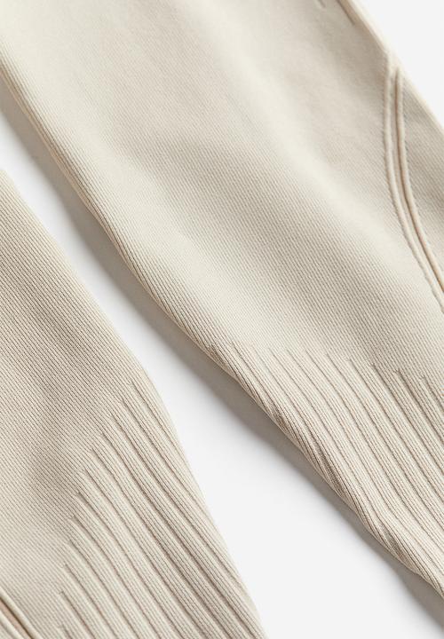 H&M - Drymove™ seamless sports tights - light beige