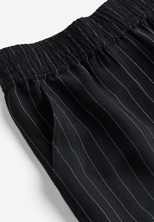 H&M - Pinstriped trousers - black/pinstriped