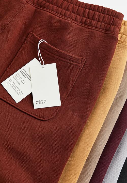 H&M - Relaxed fit cotton joggers - rust red