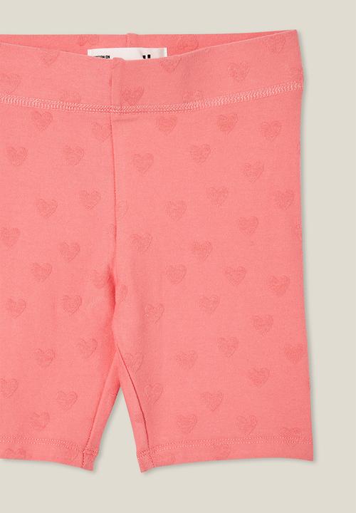 Cotton On - Hailey bike short - orange coral/hearts