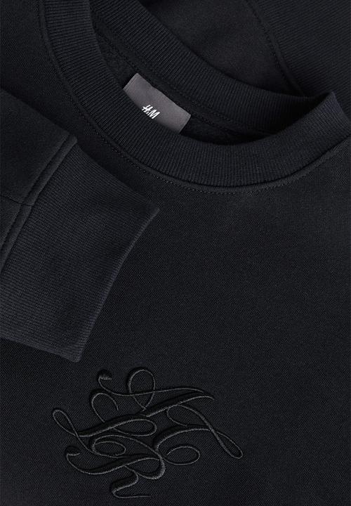 H&M - Relaxed fit appliquéd sweatshirt - black