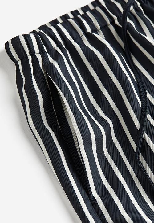H&M - Wide trousers - navy blue striped