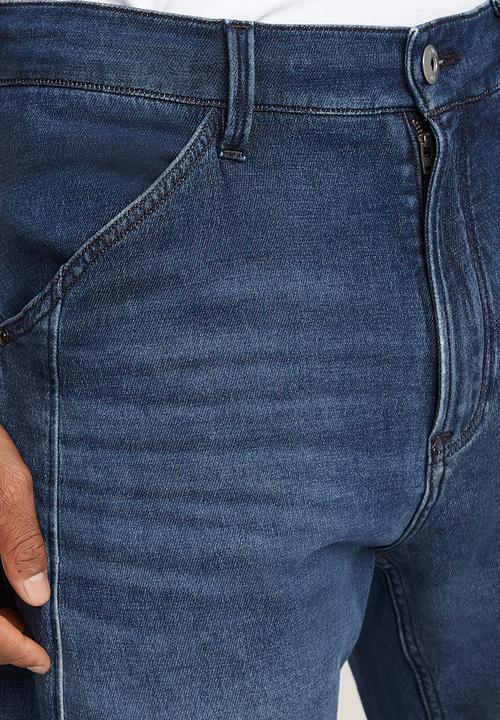 G-STAR - Denim trainer - worn in cloudy sky