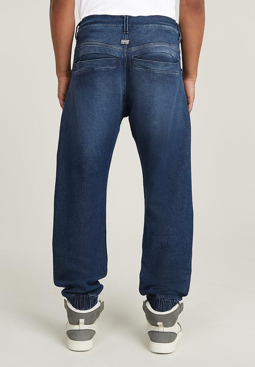 G-STAR - Denim trainer - worn in cloudy sky