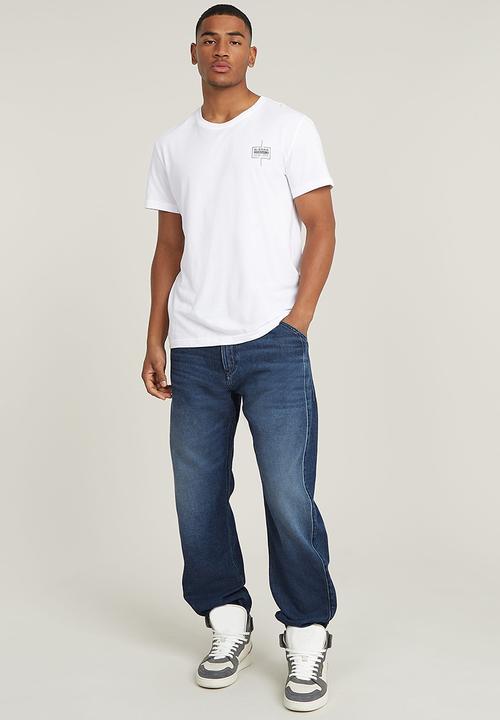 G-STAR - Denim trainer - worn in cloudy sky
