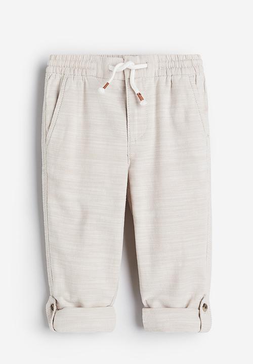 H&M - Loose fit roll-up trousers - light beige