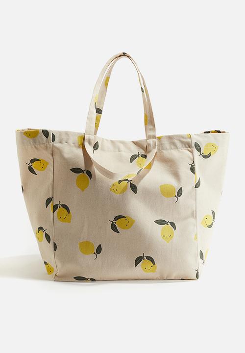 Patterned beach bag - light beige lemons