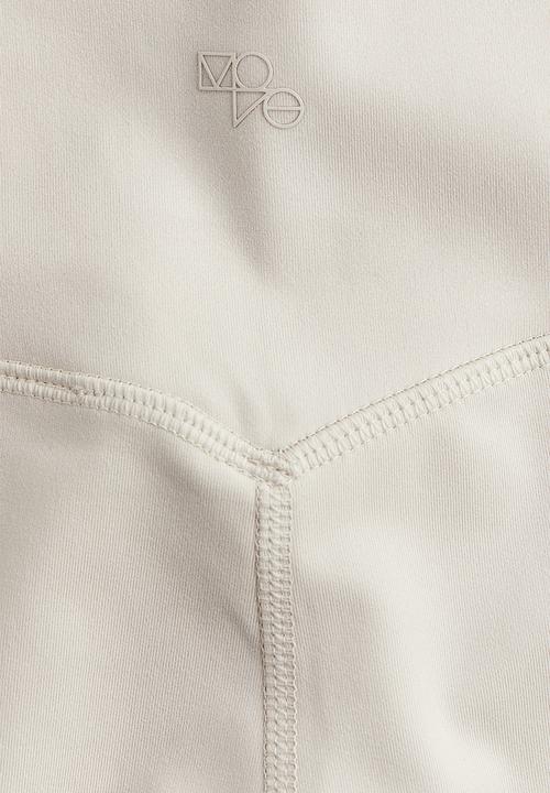 H&M - Drymove™ flared sports leggings - beige