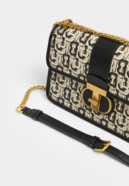 Jo Borkett - Monogram flapover sling - black & neutral