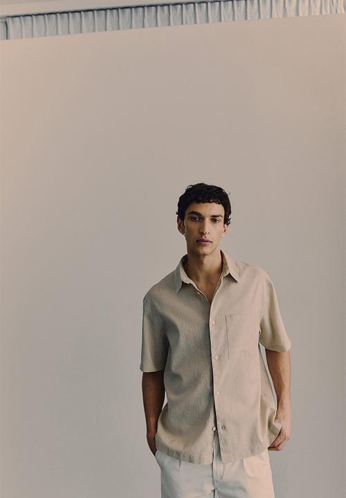 H&M - Loose fit short-sleeved linen-blend shirt - beige