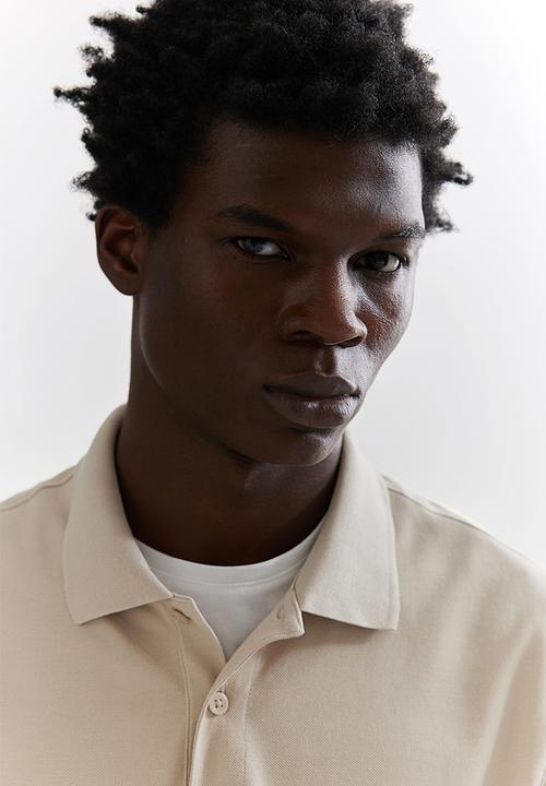 H&M - Regular fit piqué polo shirt - beige