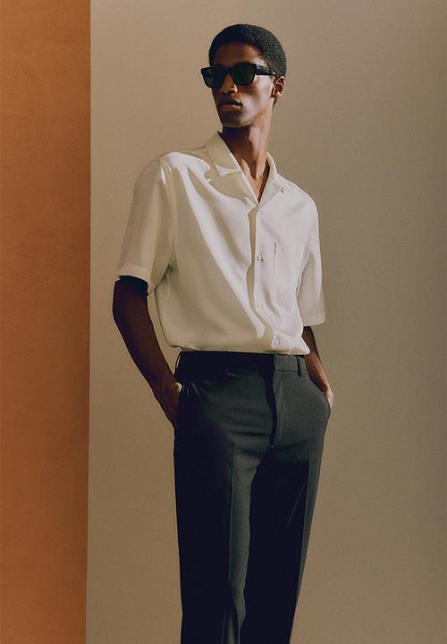 H&M - Slim fit trousers - black