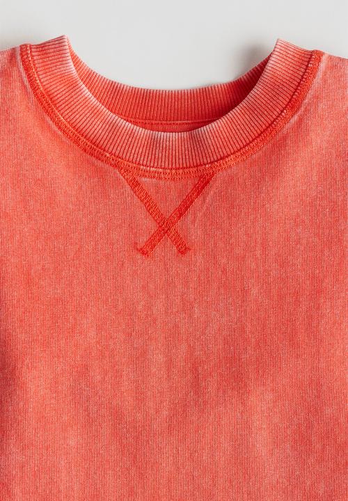 H&M - Keith Haring X H&M:  Washed-look T-shirt - light red