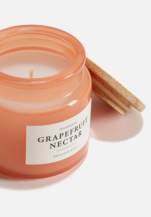 H&M - Scented candle in glass holder - orange/grapefruit nectar