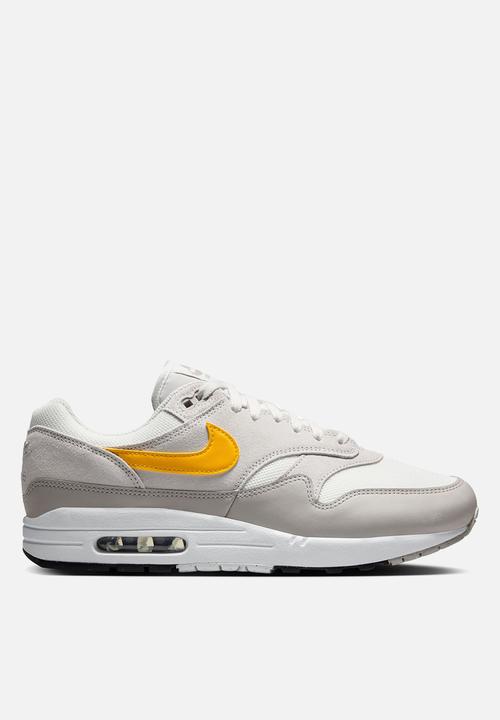 nike gold and grey